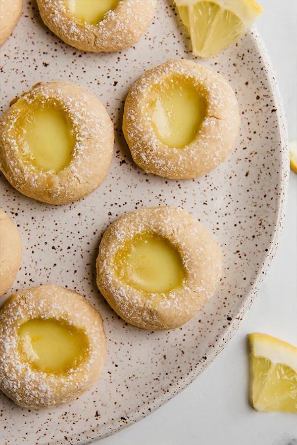 Plate of lemon bar thumbprint cookies.