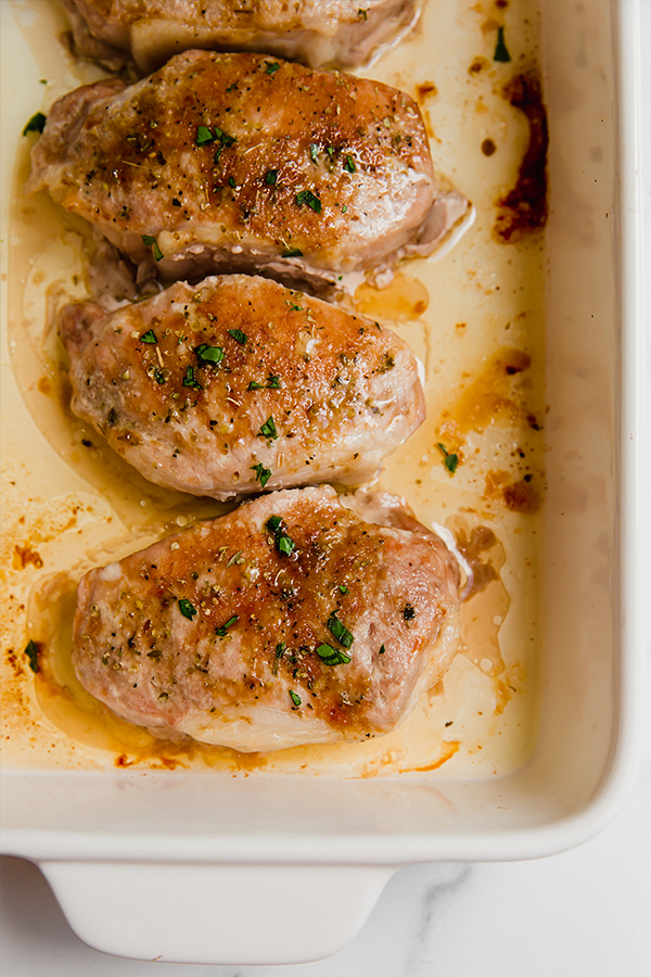 Baked pork chops in a baking dish