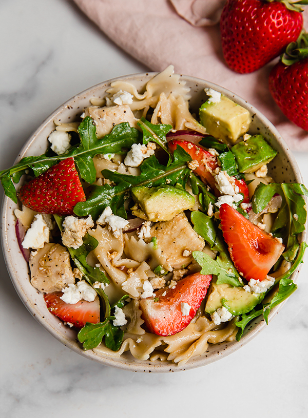 Strawberry balsamic pasta salad in a bowl.