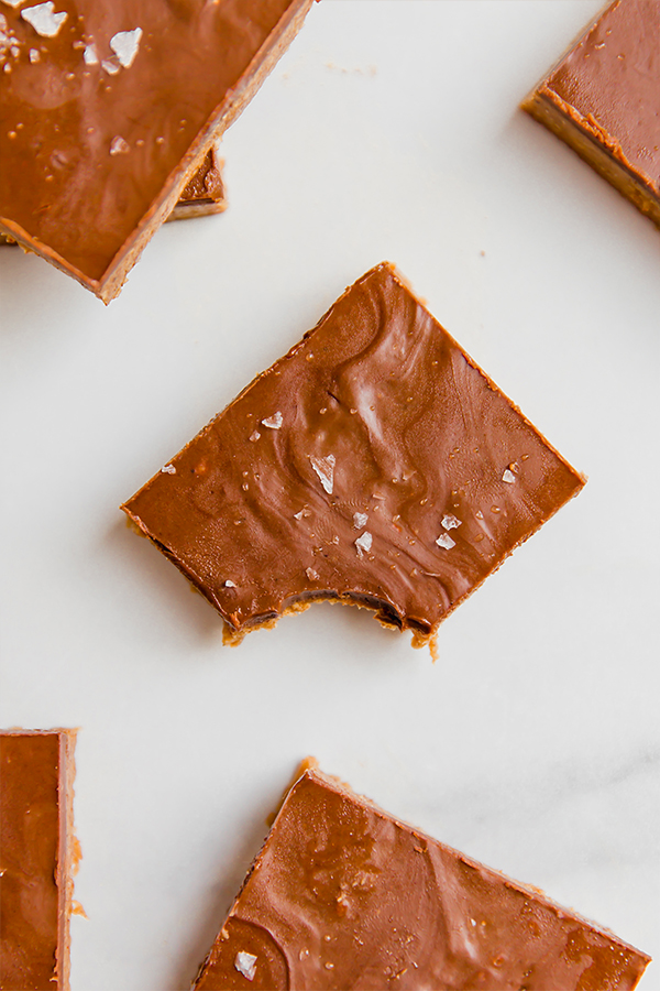 Chocolate almond butter bar with one bite missing.