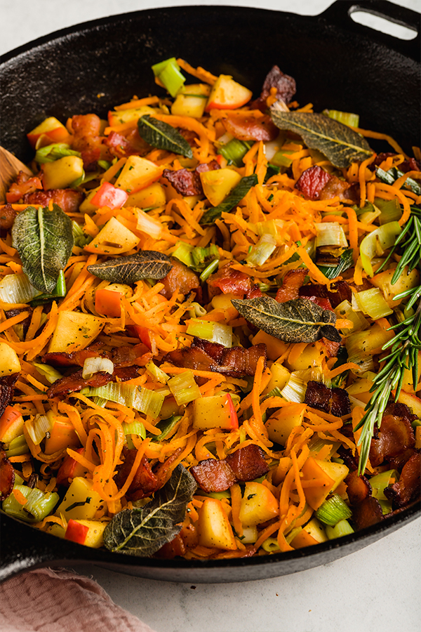 Colorful carrot, apple, and bacon breakfast hash.
