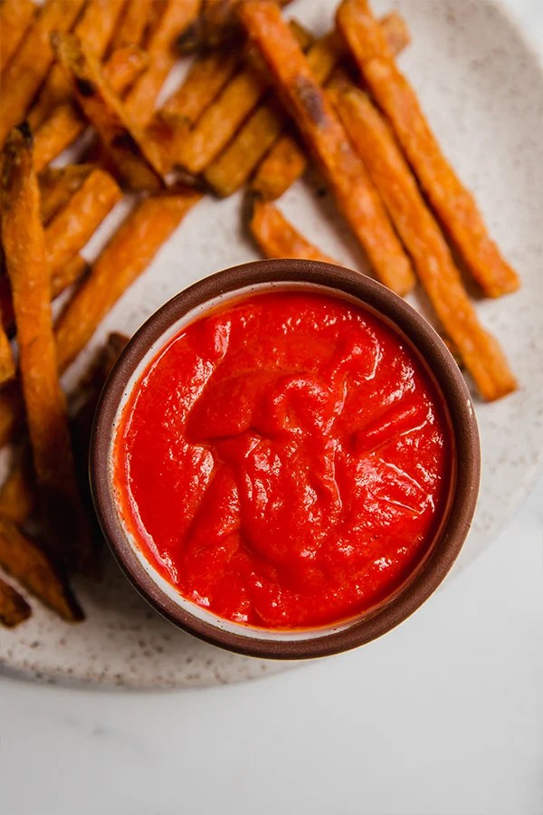 Tomato-free ketchup on a plate with fries.