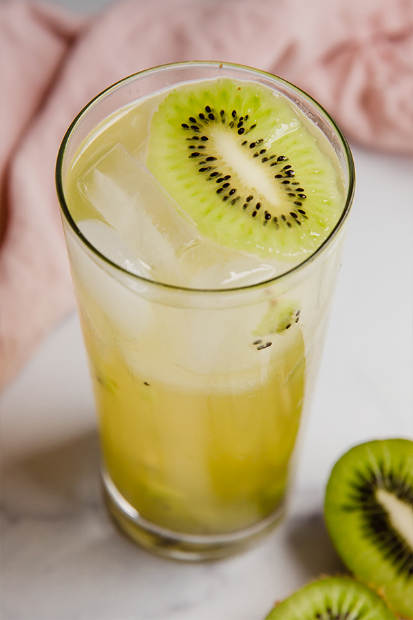 Kiwi refresher in a glass with ice