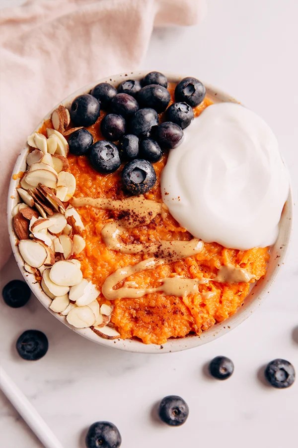 Sweet potato breakfast bowl with nuts and berries.