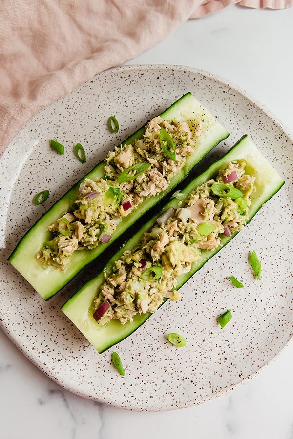 Hollowed-out cucumbers filled with tuna salad.