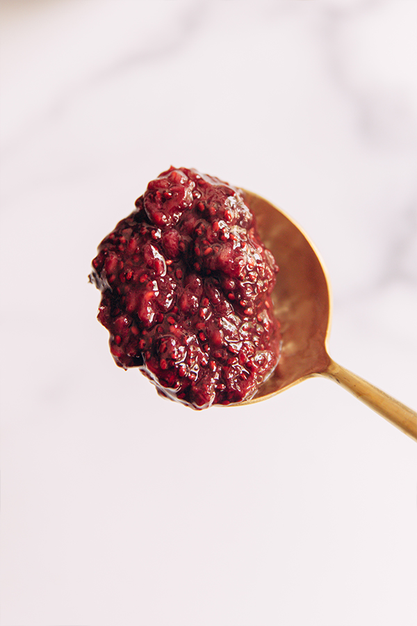 Spoon with a scoop of fruit mixture.