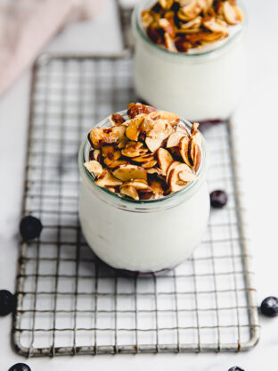 Fruit-on-the-bottom yogurt jar topped with honey roasted almonds.