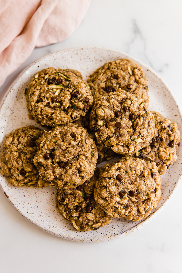Chocolate chip oatmeal zucchini cookies on a plate.