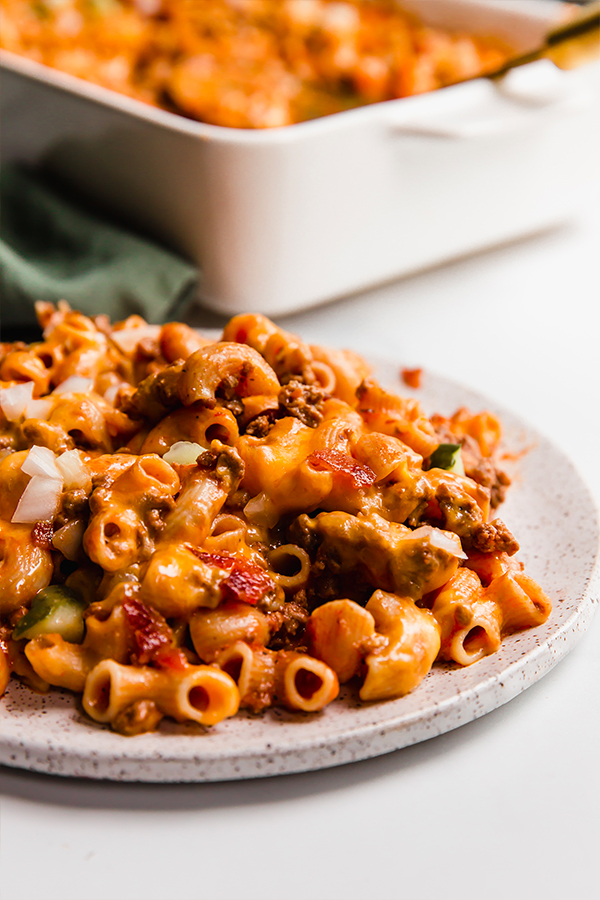 A plate with a serving of bacon cheeseburger no boil pasta bake.