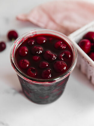 Glass of maraschino cherries.