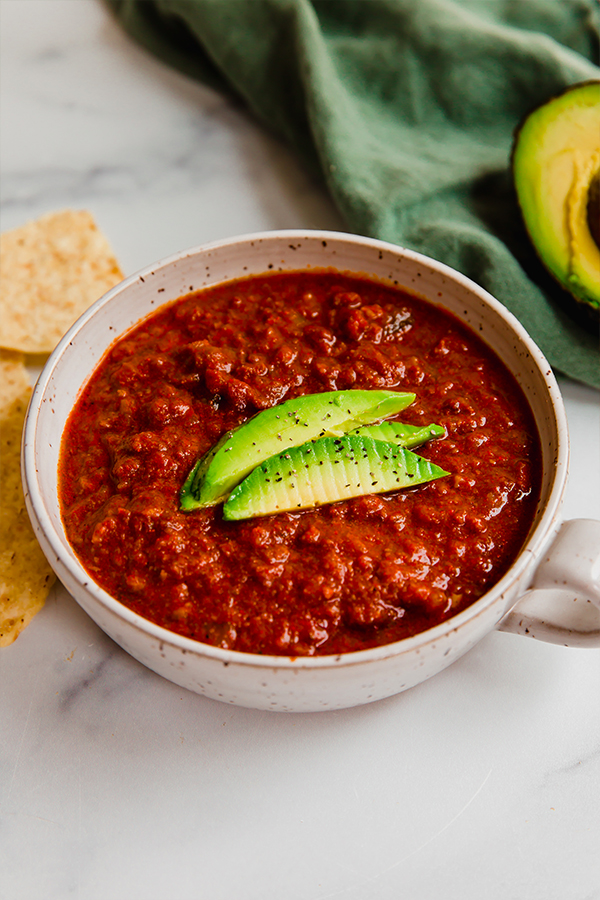 Chili topped with avocado.