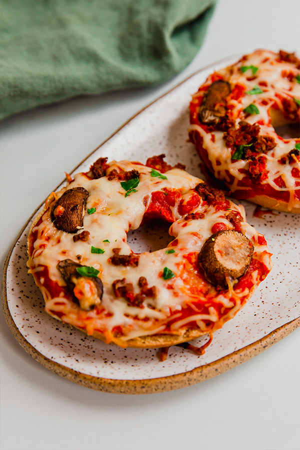 Gluten-free pizza bagels on a plate.
