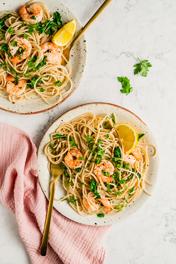 Plates of lemon garlic shrimp pasta.