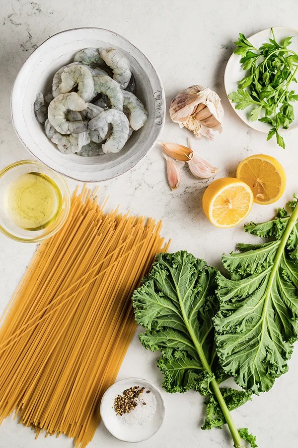 Ingredients for lemon garlic shrimp pasta on countertop
