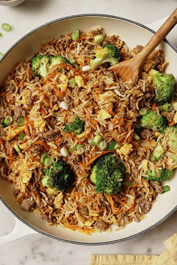 Ground beef fried rice in a pan.