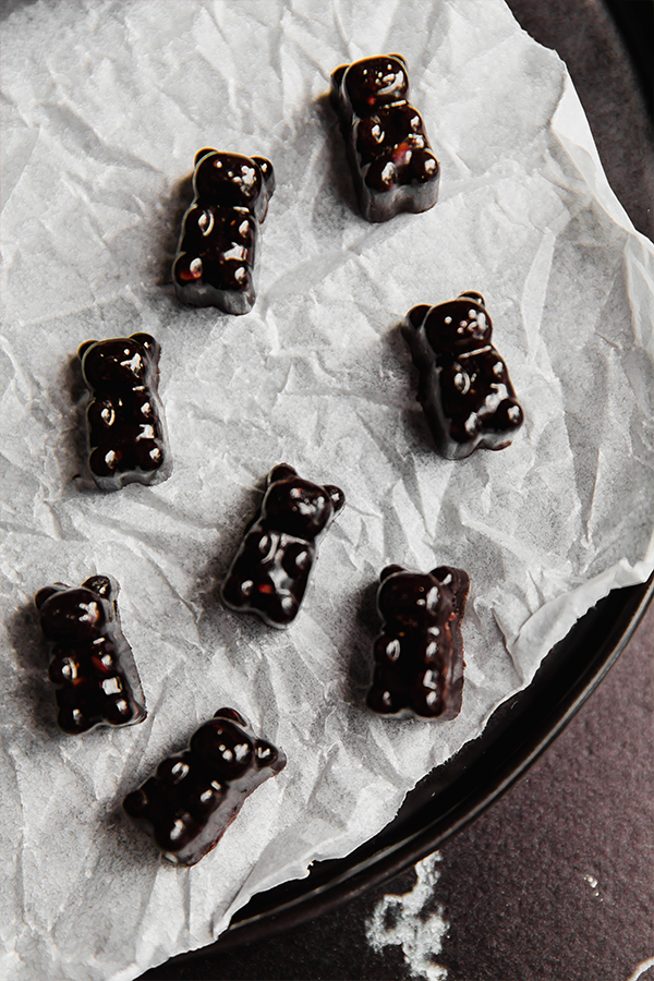 Gummies molded into bears on a white cloth.