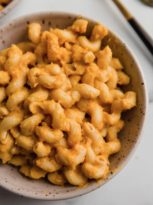 Bowl of noodles with butternut squash pasta sauce.