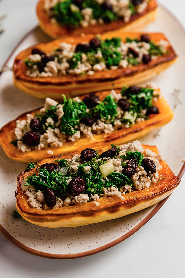 Stuffed Delicata squash on a plate.