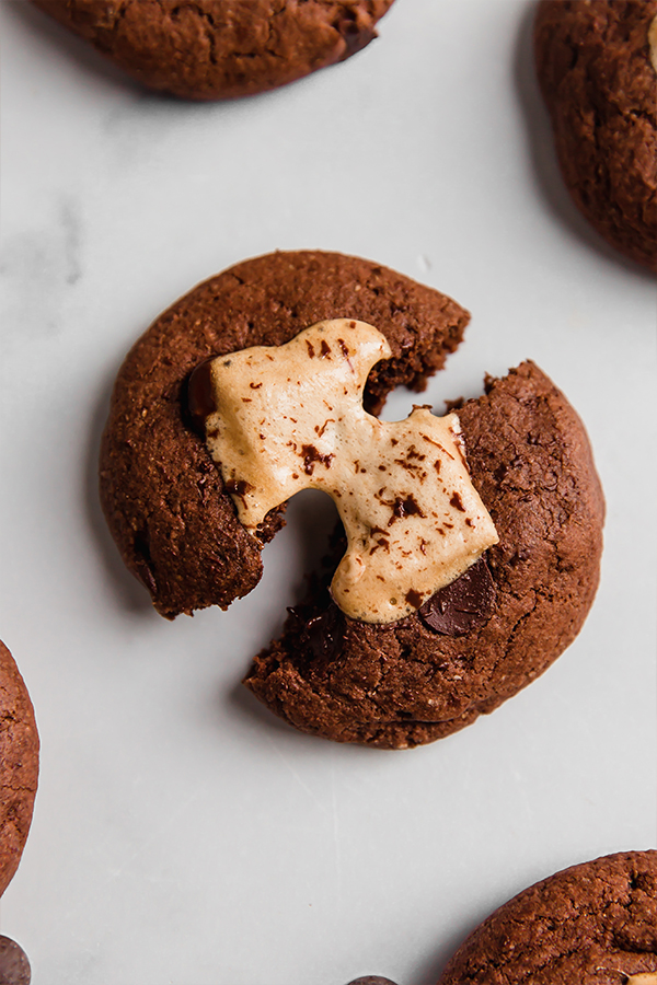 A hot cocoa cookie being pulled apart.