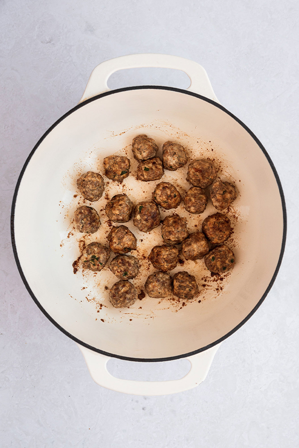 A dutch oven with meatballs.