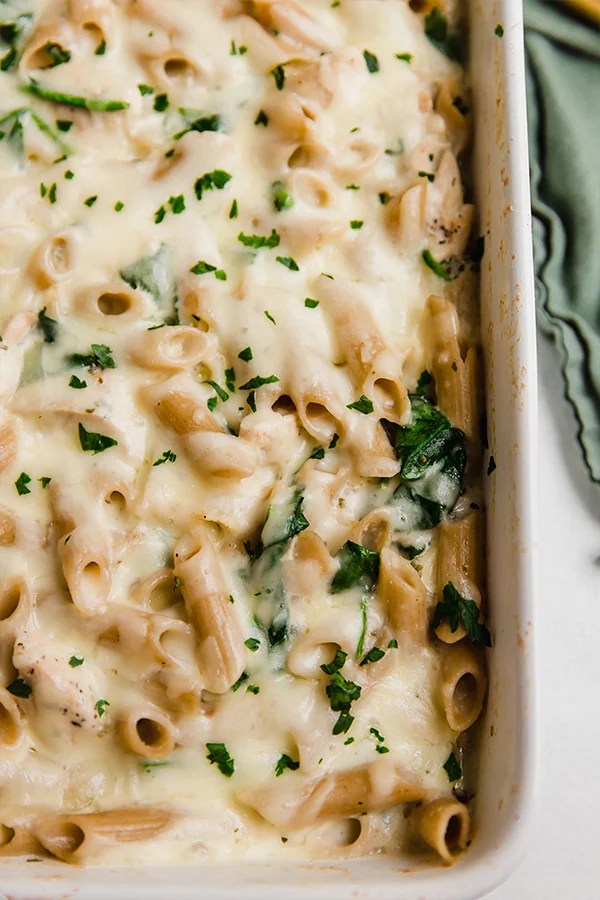 Baking dish of chicken alfredo pasta.