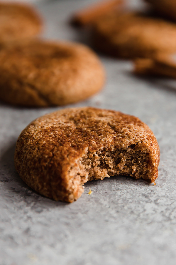 A bite taken out of a chai snickerdoodle cookie.