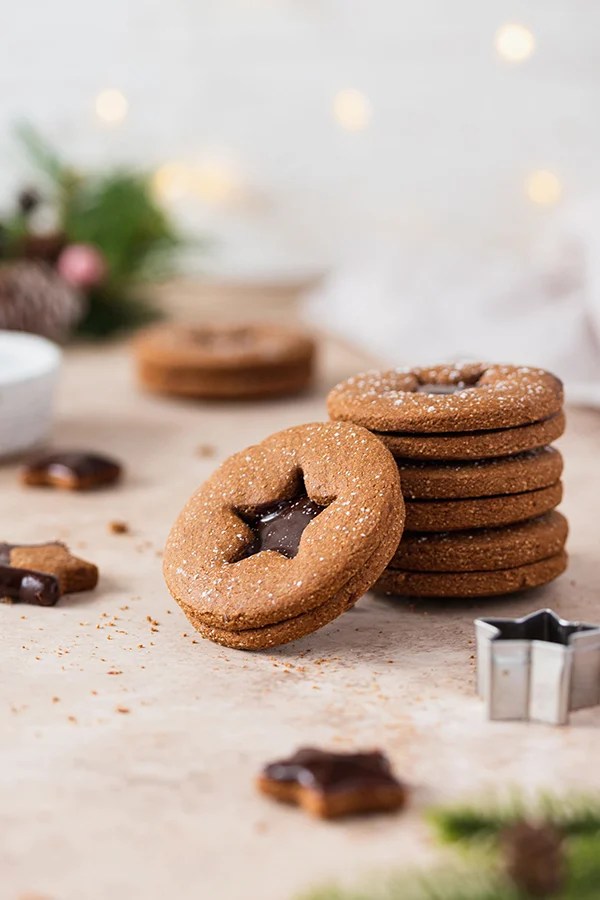 A stack of chocolate gingerbread sandwich cookies.