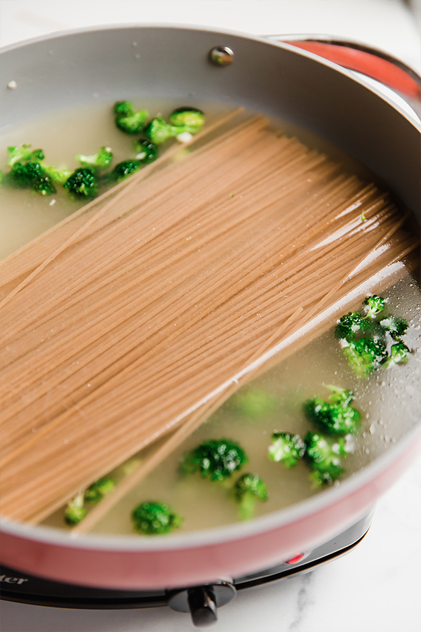 A pot ready to cook pasta and broccoli.