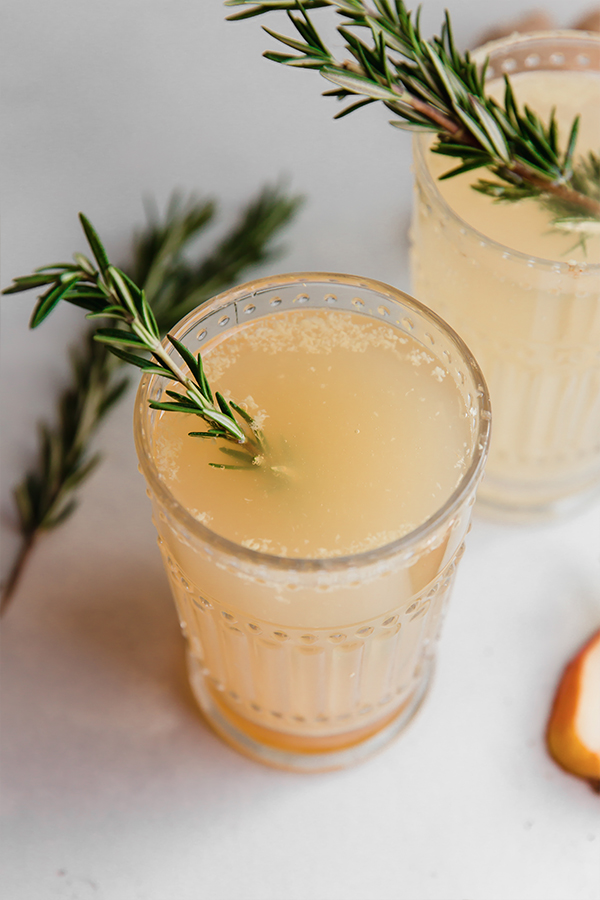A glass of sparkling ginger pear mocktail.