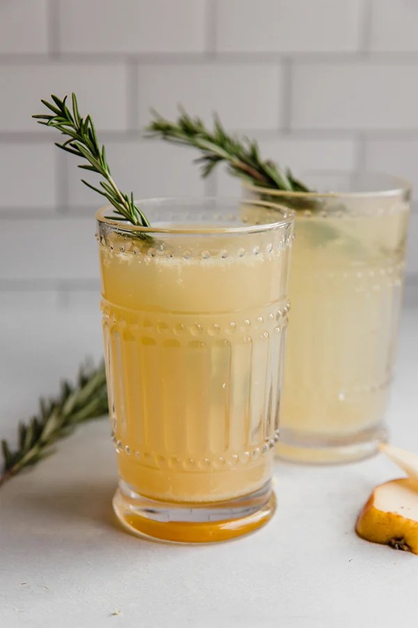 Two glasses of sparkling ginger pear mocktail.