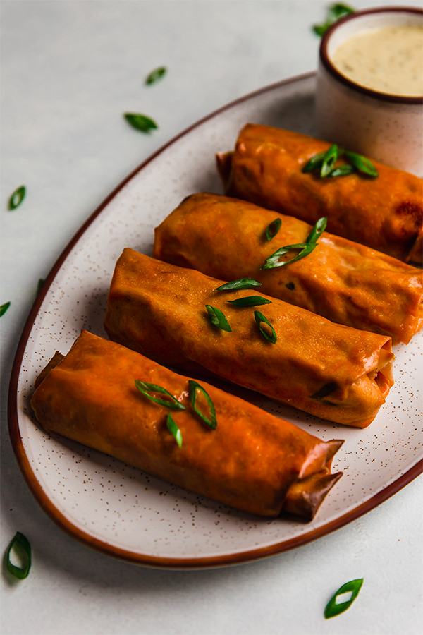 Platter of buffalo chicken egg rolls.