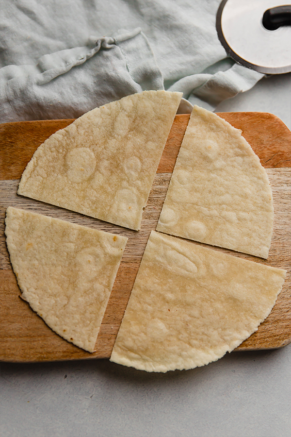 A tortilla sliced into quarters.