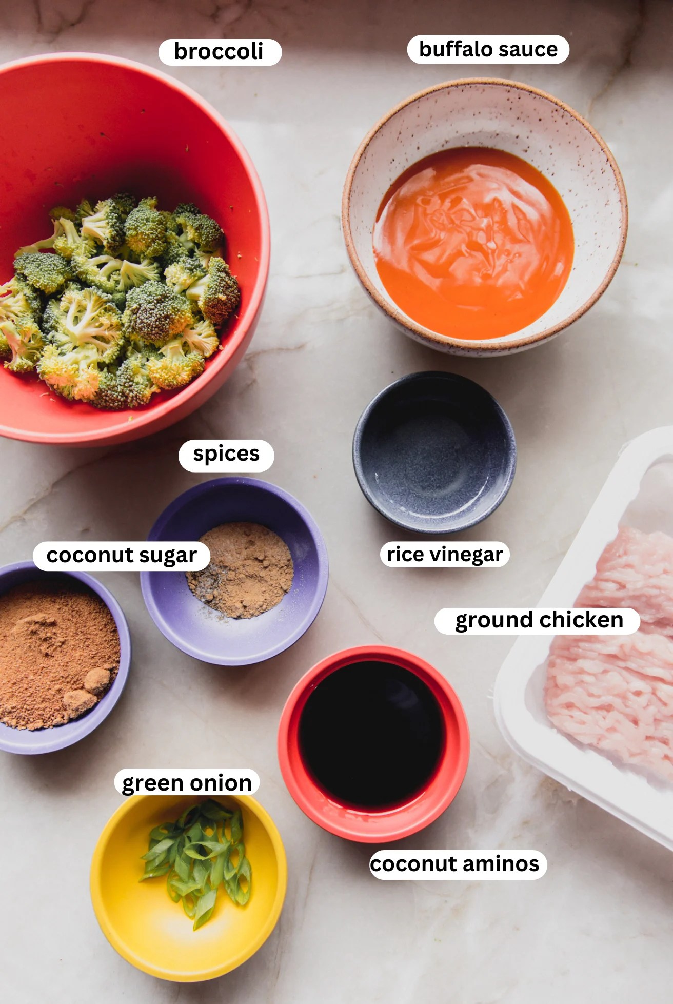 Firecracker chicken bowl ingredients in bowls.