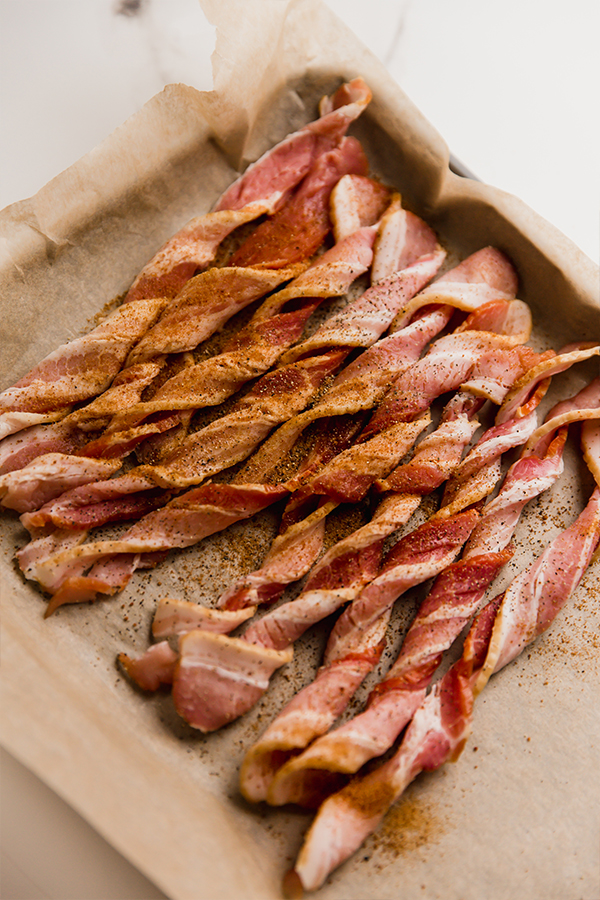 Oven bacon twists on a sheetpan before baking.