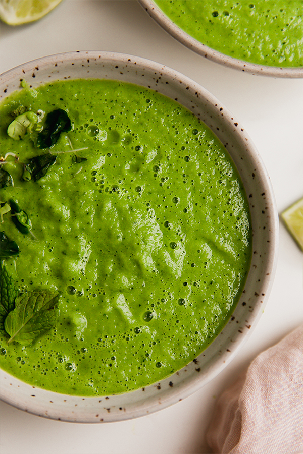 Bowl of green cucumber gazpacho.
