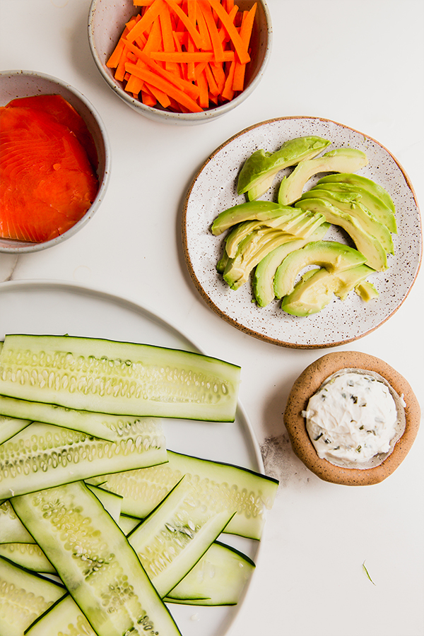 The ingredients for smoked salmon cucumber bagel rolls.