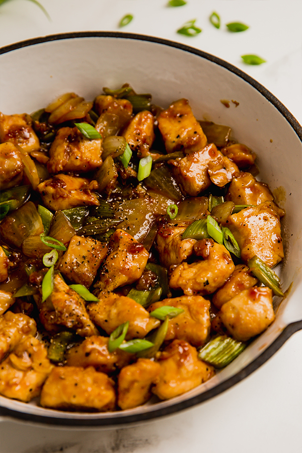 A bowl of black pepper chicken stir fry.