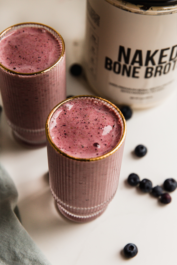 Two tall glasses of power berry smoothie.