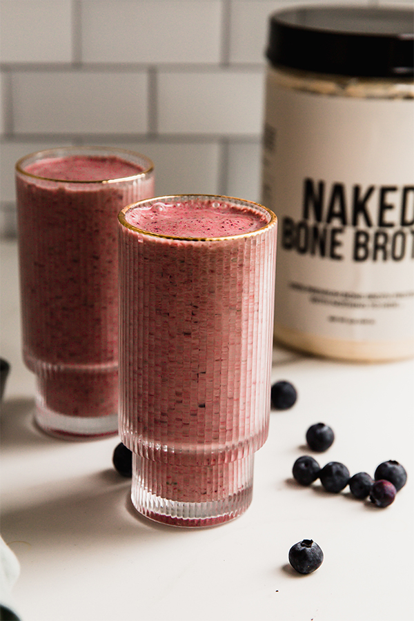 Power berry smoothie with a container of Naked Bone Broth.