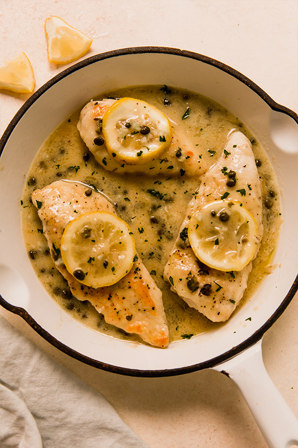 Creamy chicken piccata in a pan.