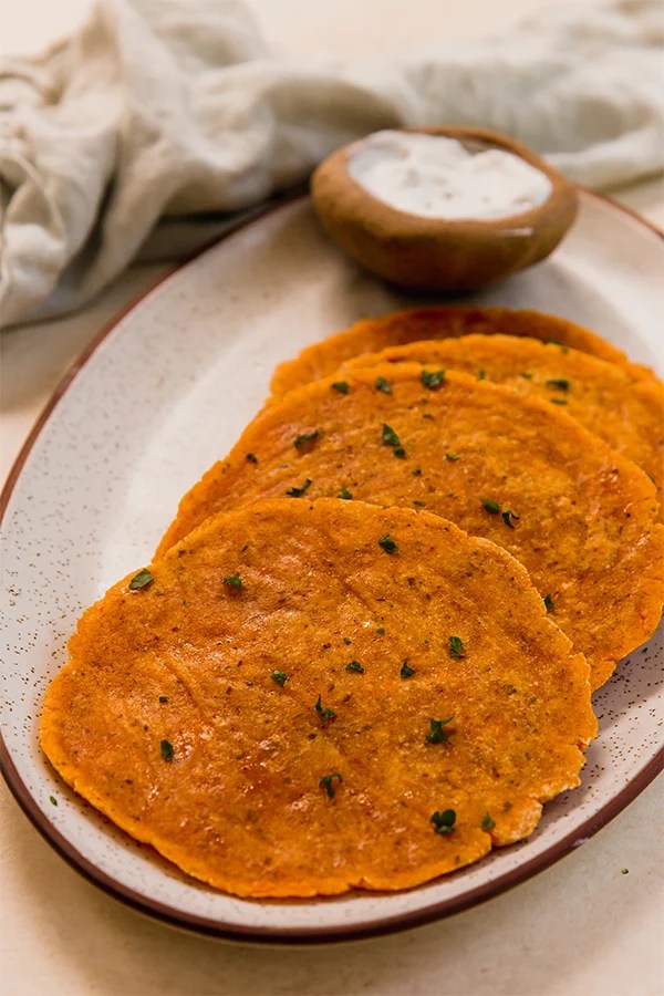 Sweet potato flatbread lined up on a plate.
