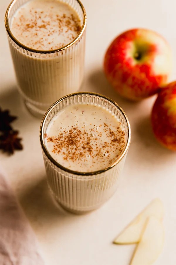 Tall glasses of apple smoothie.