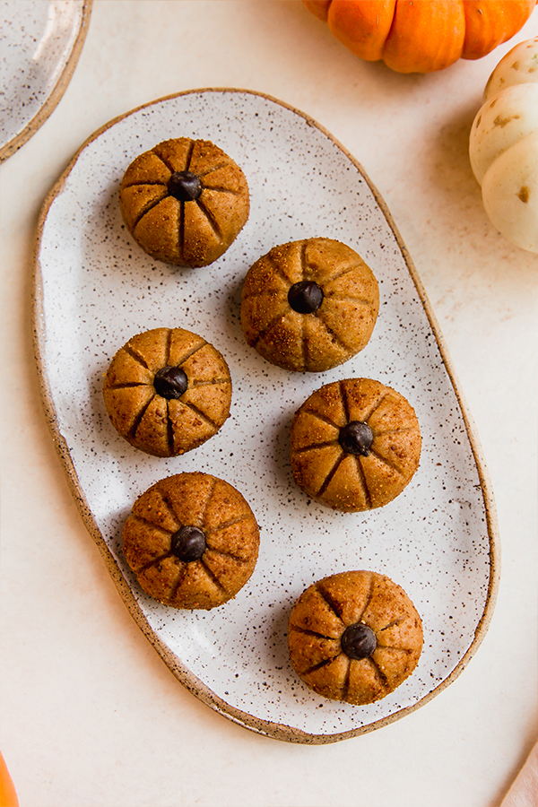 A platter filled with pumpkin buckeyes