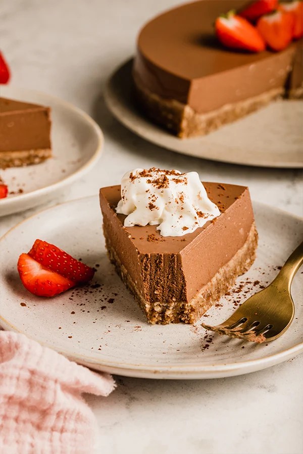 Slice of chocolate pie on a plate with a fork.