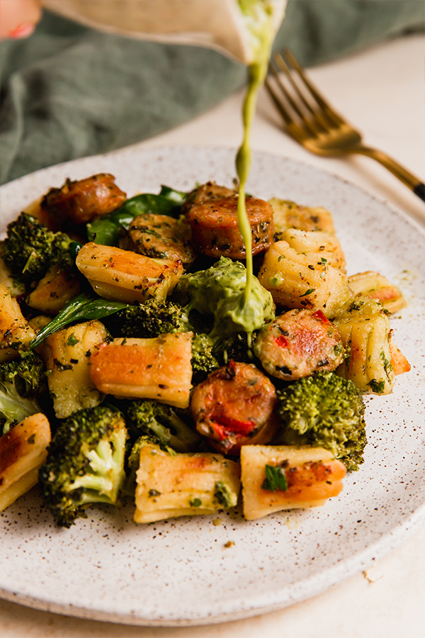 A plate with gnocchi & sausage sheet pan dinner.
