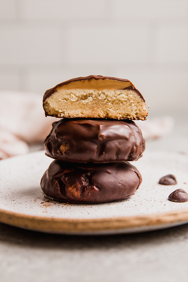 A plate stacked with copycat tagalong cookies