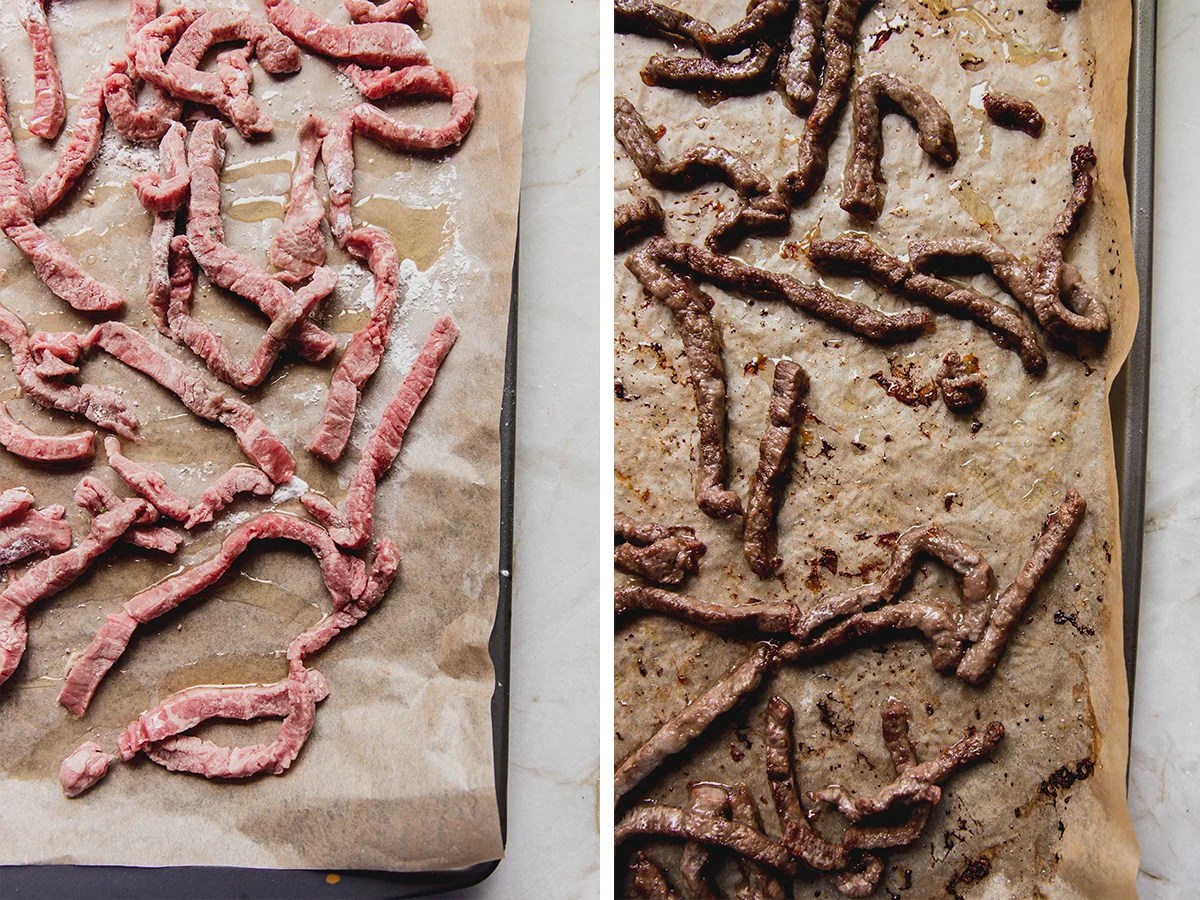 Beef on a lined baking sheet.
