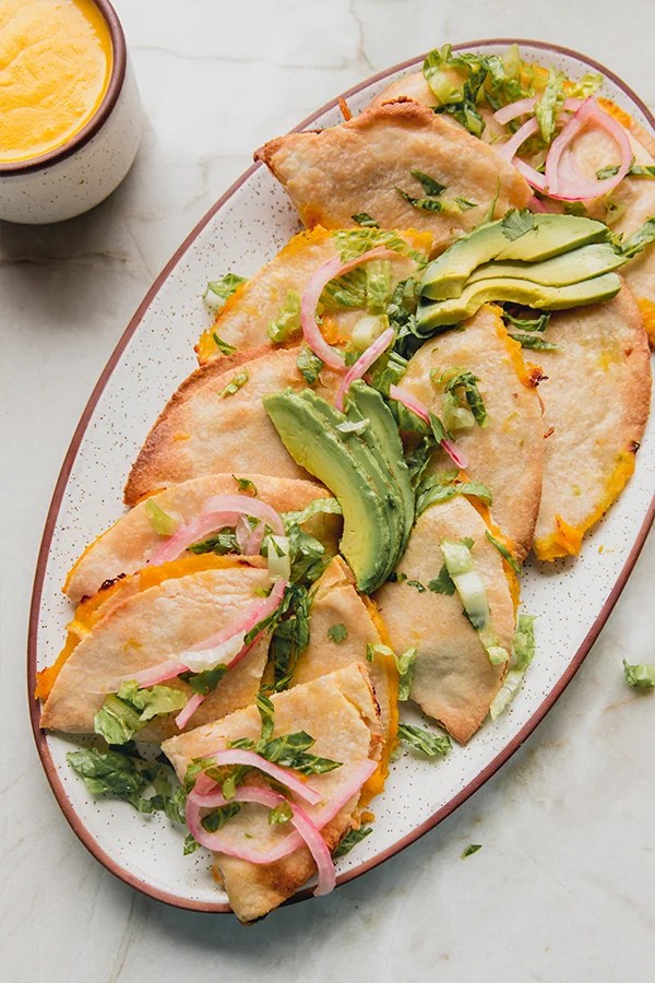 Baked chicken quesadillas on a platter.