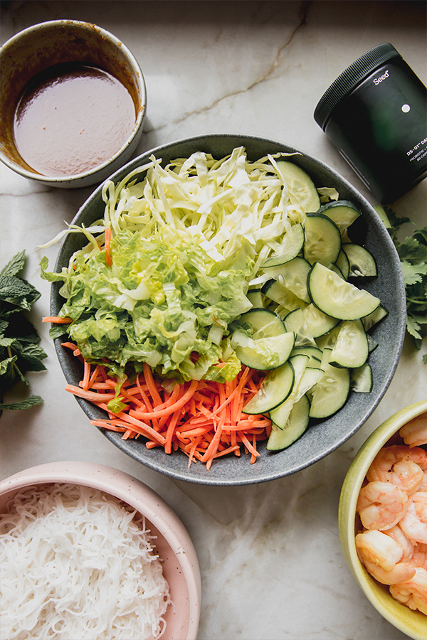 Sliced vegetables unmixed in a bowl.