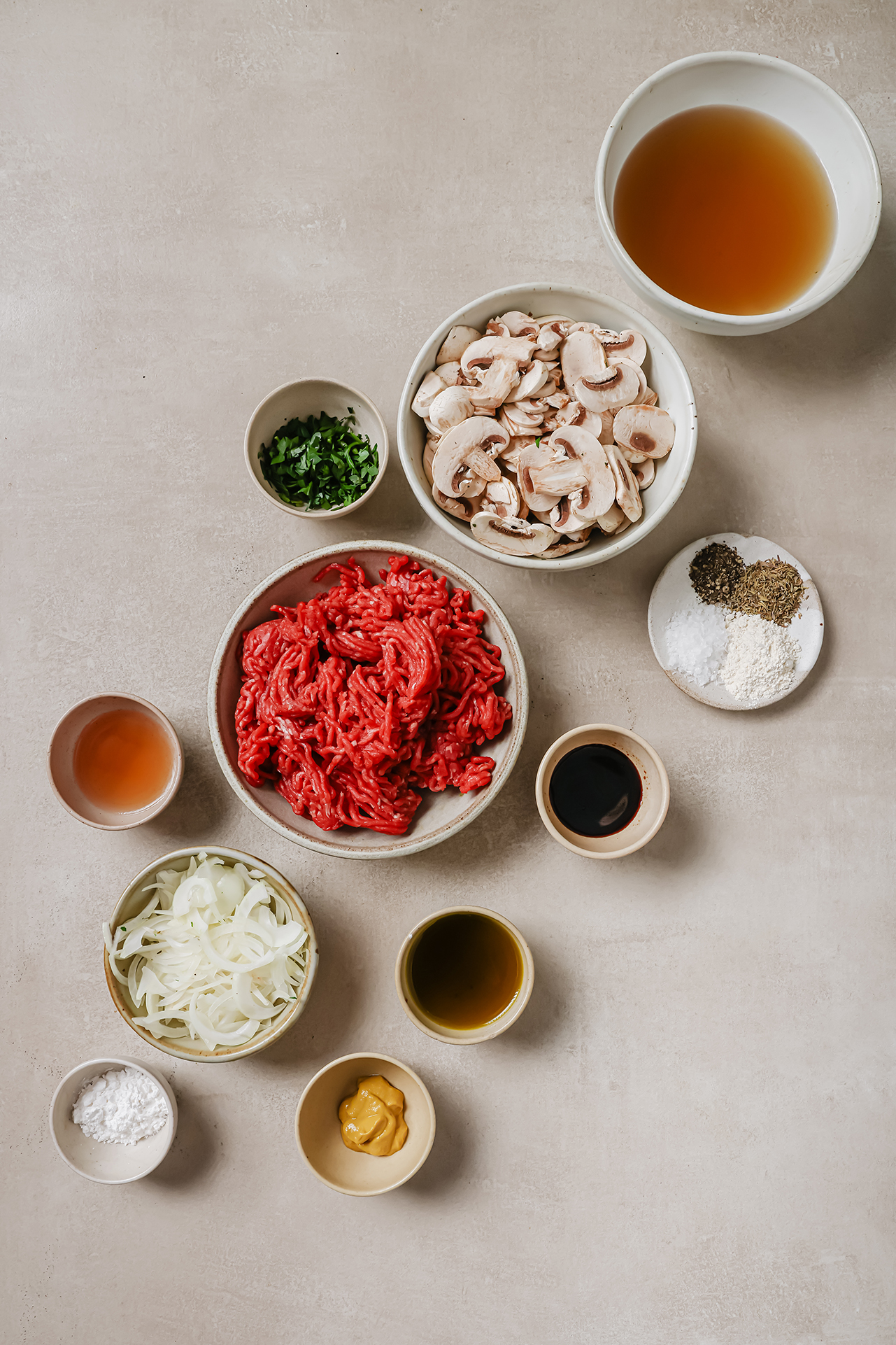Hamburger steak ingredients in separate bowls.